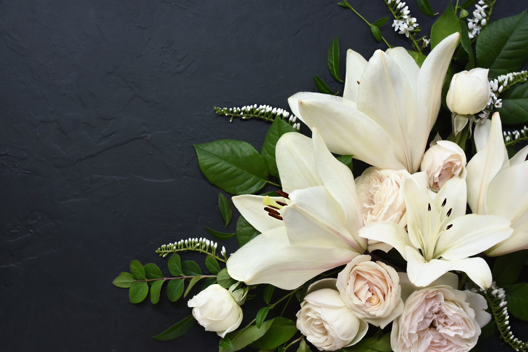 White delicate lily flowers composition, condolence flower background card, funeral concept image